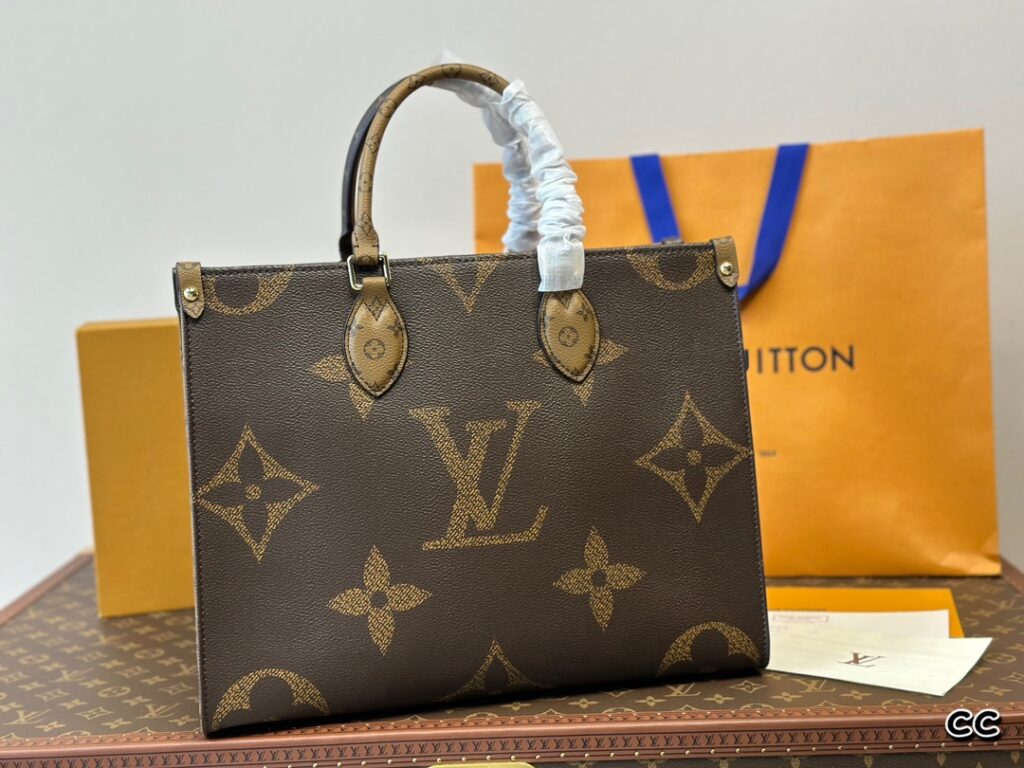 This OnTheGo medium Monogram Empreinte embossed leather item measures 36 centimeters.